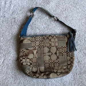 Coach purse with light blue snake skin design strap